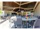 Inviting outdoor bar area with ample seating, a well-equipped bar, and a covered patio at 18114 Gawthrop Dr # 201, Bradenton, FL 34211