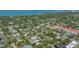 An aerial view of a neighborhood showcasing lush greenery and serene waterways near the beautiful Sarasota Bay at 1934 Bougainvillea St, Sarasota, FL 34239