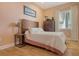 Relaxing bedroom with hardwood floors, peach walls, large picture window and modern furnishings at 1934 Bougainvillea St, Sarasota, FL 34239