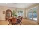 Bright dining room with hardwood floors and french door access to the outdoors at 1934 Bougainvillea St, Sarasota, FL 34239