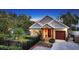 Cozy home with well-maintained landscaping, a charming entrance, and a side-entry garage at 1934 Bougainvillea St, Sarasota, FL 34239