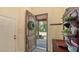 Open foyer showcasing a wooden door, tile flooring, and a glimpse of the outdoor landscape at 1934 Bougainvillea St, Sarasota, FL 34239