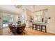 Open-concept kitchen with island, breakfast bar, and a dining area at 1934 Bougainvillea St, Sarasota, FL 34239