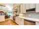 Kitchen featuring stainless steel appliances, white cabinets, and subway tile backsplash at 1934 Bougainvillea St, Sarasota, FL 34239
