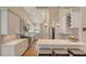 Kitchen featuring stainless steel appliances, white cabinets, and breakfast bar at 1934 Bougainvillea St, Sarasota, FL 34239