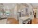 Kitchen featuring stainless steel appliances, white cabinets, and breakfast bar at 1934 Bougainvillea St, Sarasota, FL 34239