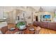 Open-concept living area with hardwood floors, a dining table, and a cozy living room setup at 1934 Bougainvillea St, Sarasota, FL 34239
