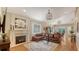 Spacious living area with a fireplace, hardwood floors, a decorative rug, and elegant furnishings at 1934 Bougainvillea St, Sarasota, FL 34239