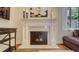 Bright living room featuring an elegant fireplace with mantel and artwork at 1934 Bougainvillea St, Sarasota, FL 34239