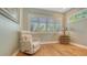 Bright room with natural light, comfortable chair, hardwood floors and side table with lamp at 1934 Bougainvillea St, Sarasota, FL 34239