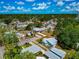 An aerial view of the house and its neighborhood, showcasing its location and the surrounding greenery at 2004 19Th W St, Bradenton, FL 34205
