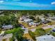 An aerial view highlights the home within its residential neighborhood, surrounded by mature trees and landscaping at 2004 19Th W St, Bradenton, FL 34205