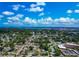 An aerial view showcasing the community, featuring a water tower and proximity to a vast bay area at 2004 19Th W St, Bradenton, FL 34205