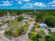 Wide aerial view of a residential neighborhood with lush greenery, tree-lined streets, and charming homes at 2004 19Th W St, Bradenton, FL 34205