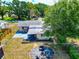 An aerial shot featuring a backyard with a seating area and patio; view of the neighborhood included at 2004 19Th W St, Bradenton, FL 34205