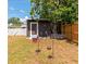 Backyard featuring a shed, bird feeders, and partial fencing, creating a private outdoor space at 2004 19Th W St, Bradenton, FL 34205
