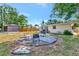Backyard showing a seating area and storage shed, enclosed by a wooden fence for privacy at 2004 19Th W St, Bradenton, FL 34205