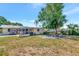 Spacious backyard featuring a covered patio and a cozy fire pit area with seating at 2004 19Th W St, Bradenton, FL 34205
