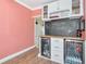Entertaining area featuring a bar with beverage coolers, chalkboard, and storage at 2004 19Th W St, Bradenton, FL 34205