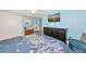 Bright bedroom featuring blue walls, laminate floors, and a large dresser at 2004 19Th W St, Bradenton, FL 34205