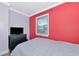 Comfortable bedroom with wood floors, large windows, and a dark dresser at 2004 19Th W St, Bradenton, FL 34205