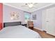 Comfortable bedroom with wood floors, large windows, and a cozy armchair at 2004 19Th W St, Bradenton, FL 34205