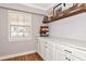 Dining room displaying white cabinets, modern decor, and floating shelf at 2004 19Th W St, Bradenton, FL 34205