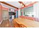 Dining area featuring wood floors, access to the backyard, and a modern chandelier at 2004 19Th W St, Bradenton, FL 34205