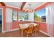 Dining room featuring wood floors, views of the backyard, and natural lighting at 2004 19Th W St, Bradenton, FL 34205