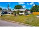 Well-maintained home featuring tropical landscaping in the front yard and a long driveway at 2004 19Th W St, Bradenton, FL 34205
