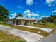 Charming single-story home with a covered porch and well-maintained landscaping, inviting curb appeal at 2004 19Th W St, Bradenton, FL 34205