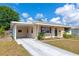 View of the home showcasing the side drive and carport at 2004 19Th W St, Bradenton, FL 34205