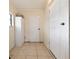 Mud room area featuring tiled floor, storage closet, and access to the backyard at 2004 19Th W St, Bradenton, FL 34205