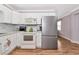 Bright kitchen showcasing white cabinetry, modern appliances, and wood-style floors at 2004 19Th W St, Bradenton, FL 34205