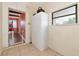 Hallway featuring tiled floor, storage closet, and pass-through access to the dining room at 2004 19Th W St, Bradenton, FL 34205