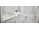 Modern bathroom featuring double vanity with white cabinets and a shower-tub combination at 204 Eagleston Ln, Lakewood Ranch, FL 34240