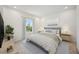 Calm bedroom with a comfortable bed, soft lighting, and a view of the neighborhood at 204 Eagleston Ln, Lakewood Ranch, FL 34240