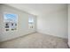 Bright bedroom with plush carpeting, and a view of the neighborhood at 204 Eagleston Ln, Lakewood Ranch, FL 34240