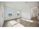 Bright bedroom with hardwood floors, two windows, and ample natural light for a comfortable atmosphere at 204 Eagleston Ln, Lakewood Ranch, FL 34240