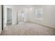 Bright bedroom features a full length mirror, recessed lighting, and large window at 204 Eagleston Ln, Lakewood Ranch, FL 34240