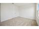 A simple bedroom with plush carpeting and a large window at 204 Eagleston Ln, Lakewood Ranch, FL 34240