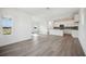 Bright living room features hardwood floors, recessed lighting, and white walls at 204 Eagleston Ln, Lakewood Ranch, FL 34240