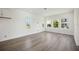 Spacious living area with hardwood floors and big windows providing plenty of natural light at 204 Eagleston Ln, Lakewood Ranch, FL 34240