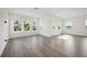 Bright and open living room features hardwood floors, recessed lighting and large windows at 204 Eagleston Ln, Lakewood Ranch, FL 34240