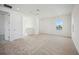 Open loft area featuring neutral carpet, natural light from windows, and recessed lighting at 204 Eagleston Ln, Lakewood Ranch, FL 34240