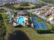 Aerial view of the clubhouse, pool, tennis and bocce ball courts at 229 Alento Ct, Nokomis, FL 34275