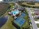 Aerial view of the clubhouse, pool, hot tub, tennis and bocce ball courts at 229 Alento Ct, Nokomis, FL 34275