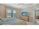 Inviting bedroom with neutral tones, a large window, and comfortable bedding, creating a relaxing retreat at 229 Alento Ct, Nokomis, FL 34275