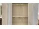 Standard closet with bifold doors, top and bottom shelf, and chrome clothes hanging bar at 229 Alento Ct, Nokomis, FL 34275