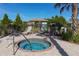 Community spa with lounge chairs and palm trees at 229 Alento Ct, Nokomis, FL 34275